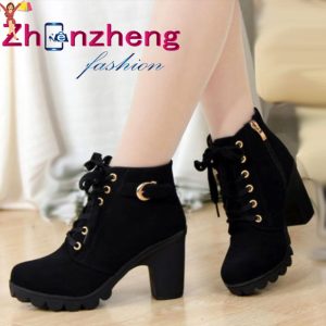 Cross-strap heel leather boots